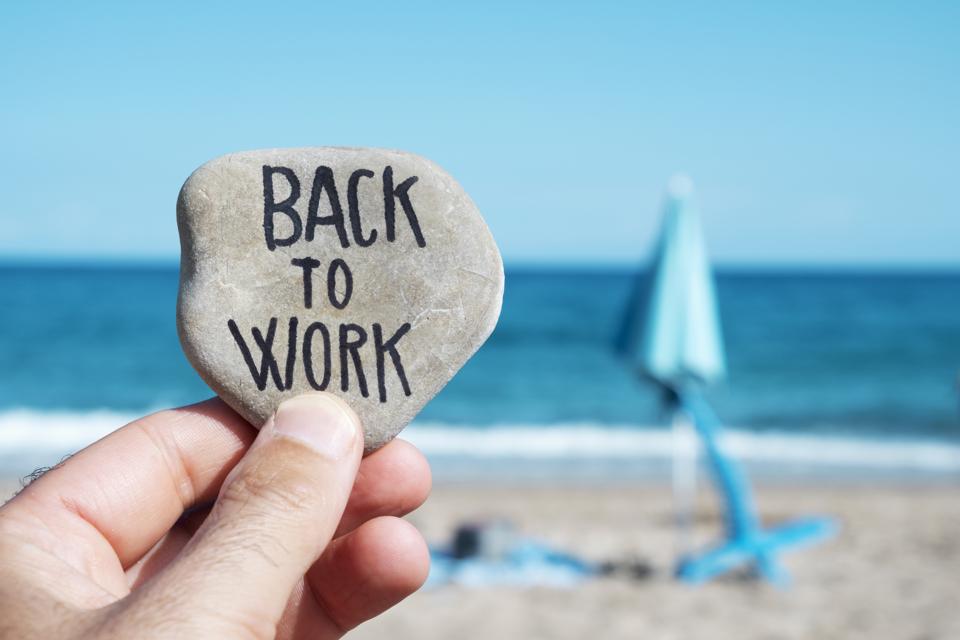 on the beach, back to work written on stone - Studio Psiché